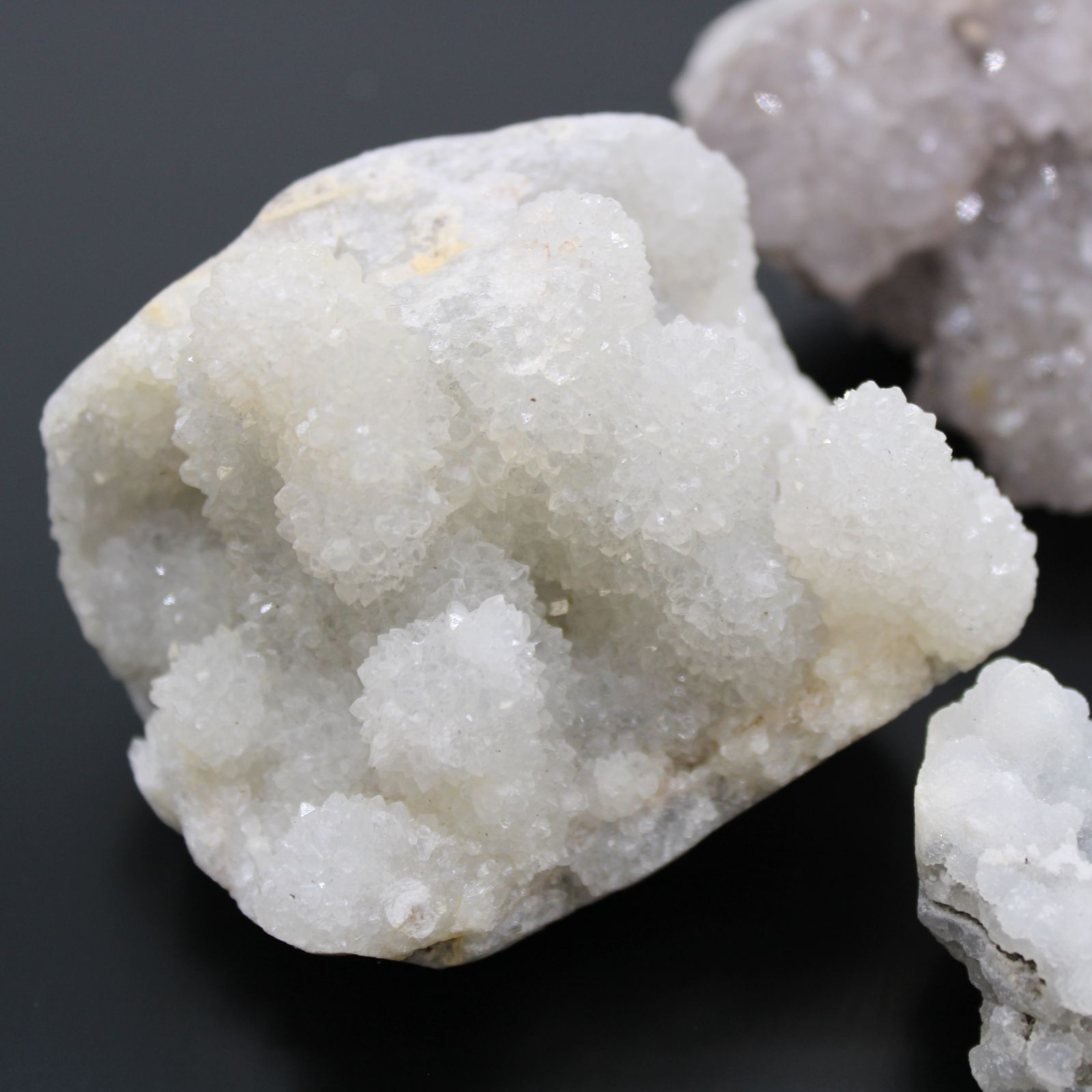 Close-up of a crystal formation on a dark background