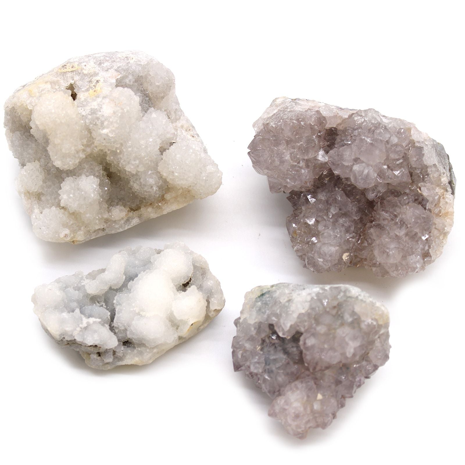 Four different types of geode crystals on a white background