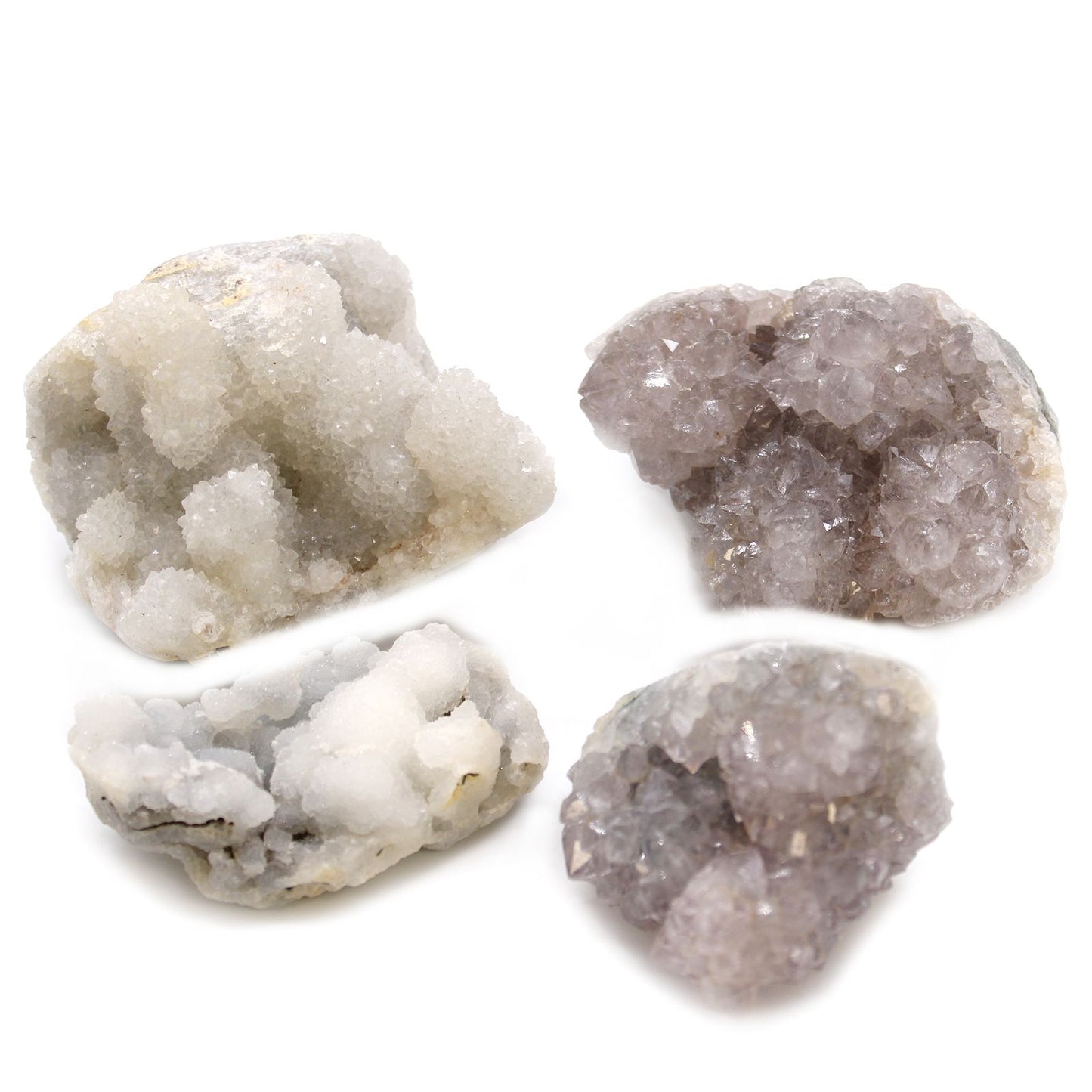 Four different textured stones on a white background