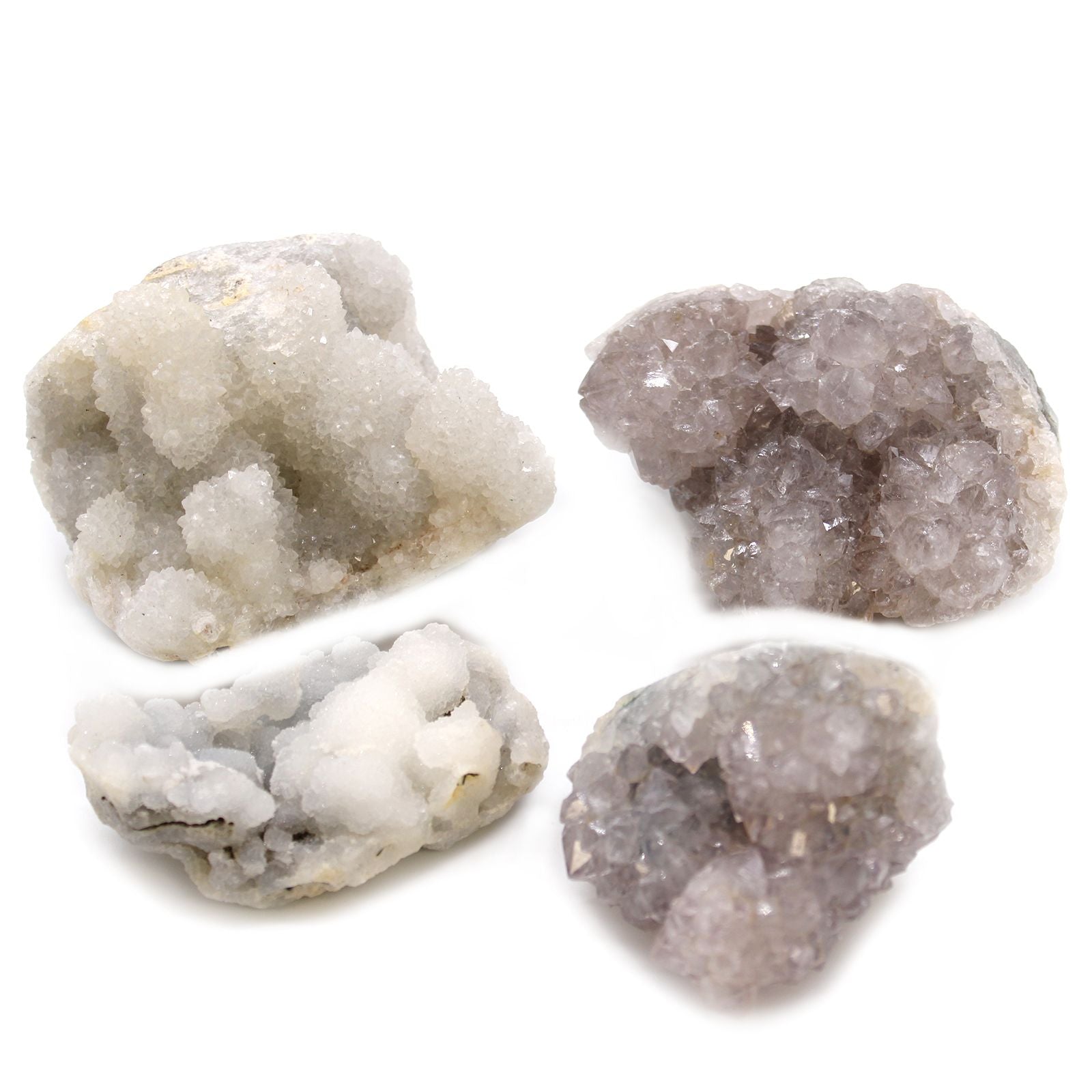 Four different textured stones on a white background