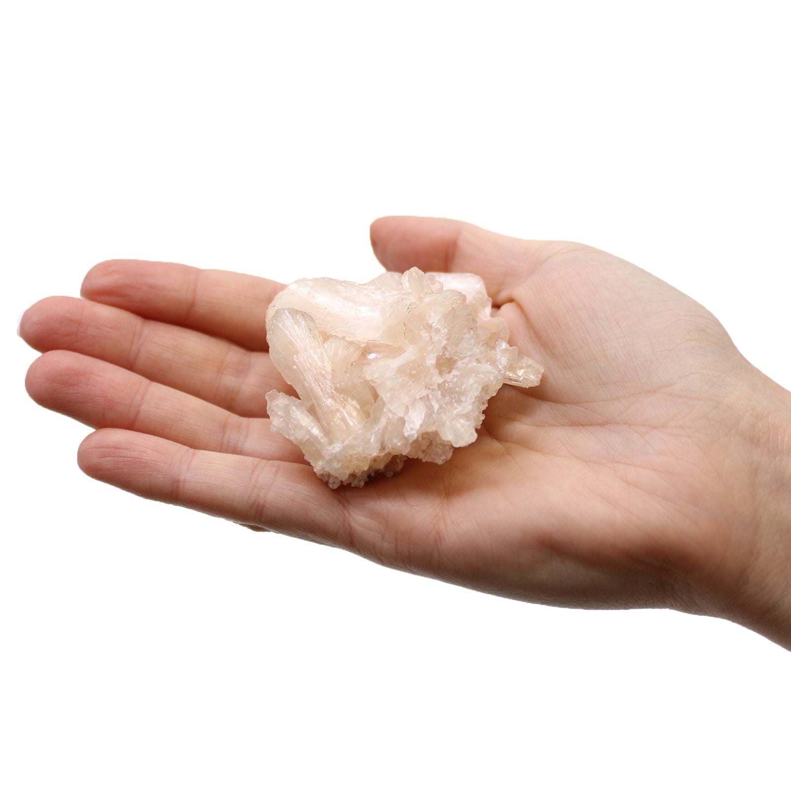 Natural crystal mineral specimen held in hand