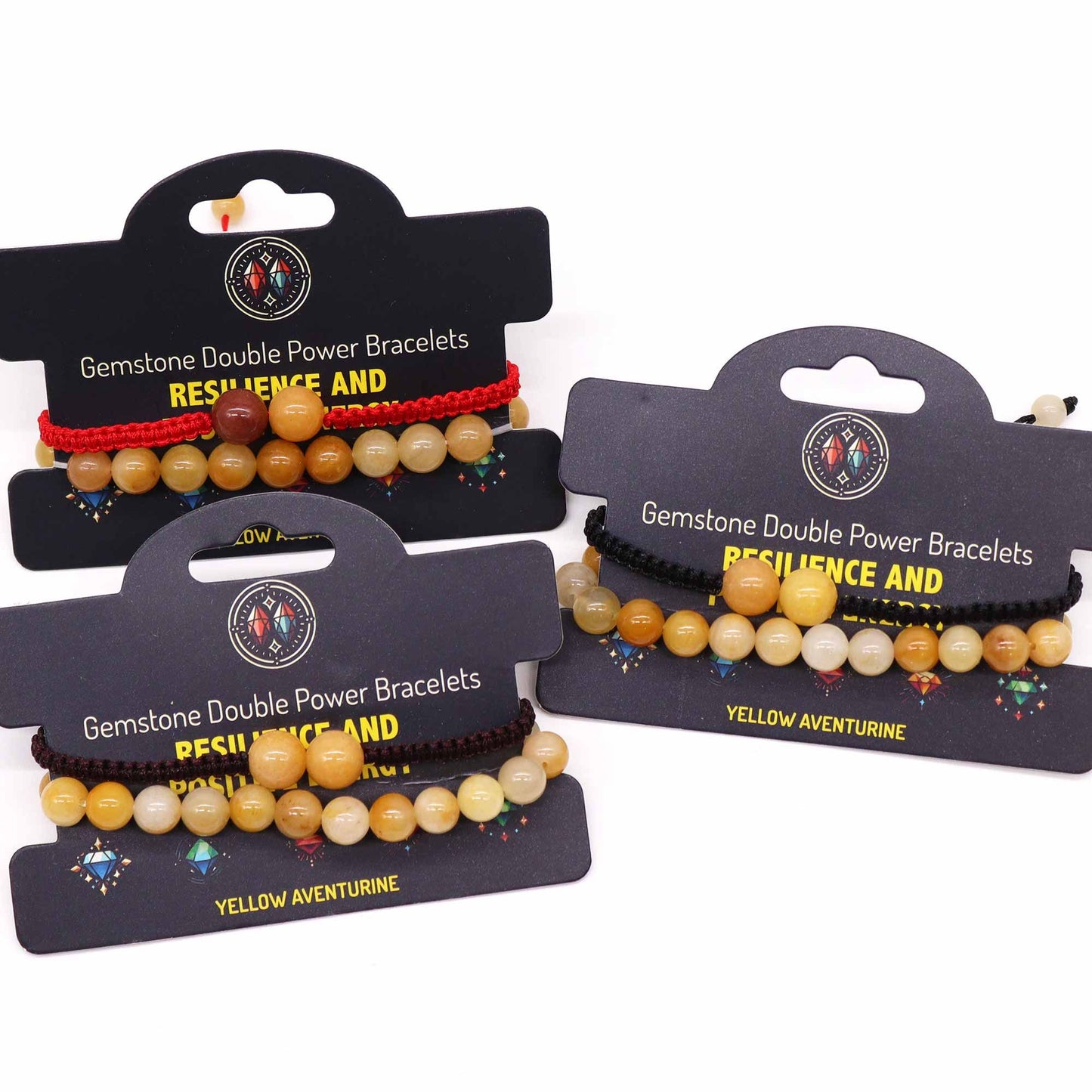 Three gemstone double power bracelets on display with packaging on a white background